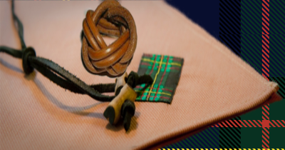 Wood Badge neckerchief, leather slides, and wooden beads